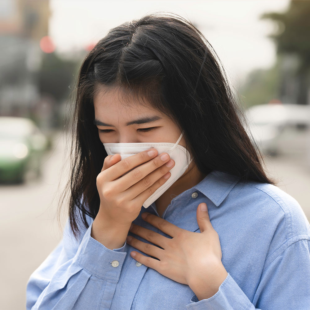 Lady covering mask with hand